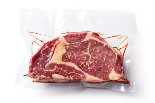 Raw meat in a vacuum sealed bag.