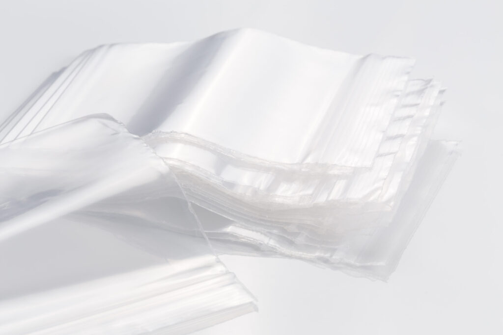 Empty transparent plastic bags on white background, reusable, re-sealable ziplock bags
